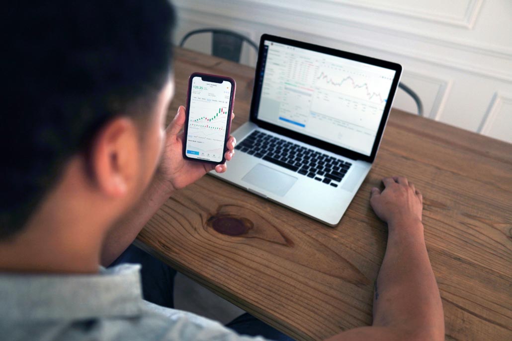 Man reviews a balance sheet on his laptop